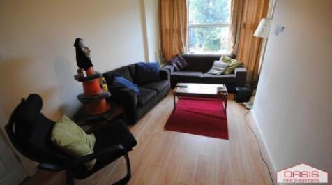 Bright, simply furnished living area with plent...