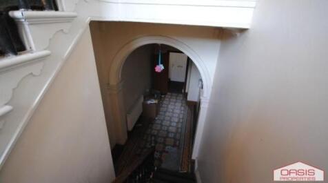 View down a traditional tiled hallway from the ...