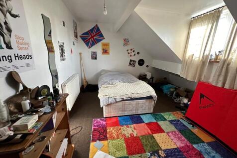 A spacious and inviting master bedroom with amp...