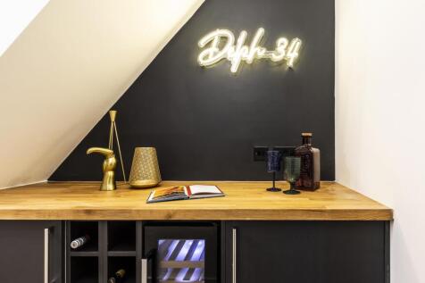 Stylish kitchenette/workspace with a wooden cou...