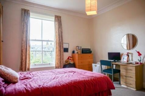 Bright, cosy bedroom with a large window, comfo...