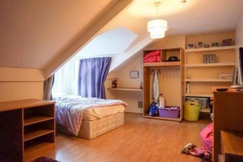 Bright attic double bedroom with sloped ceiling...