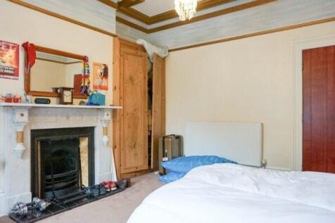 Bright traditional double bedroom with ornament...