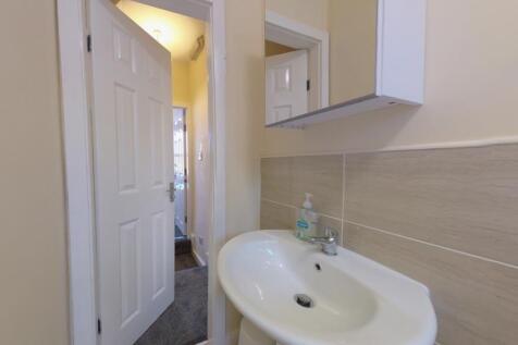 Clean, well-maintained bathroom sink area with ...