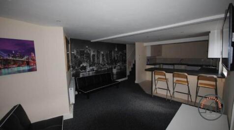 Contemporary open-plan living area with a break...