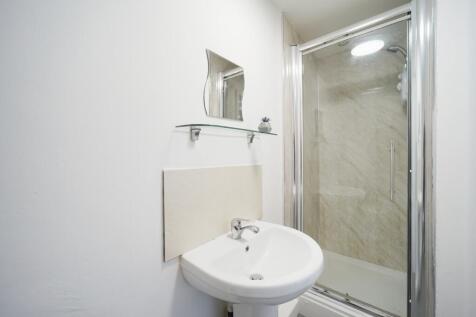 Bright, neatly presented bathroom with a modern...