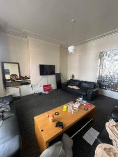 Comfortable lounge with multiple sofas, a centr...