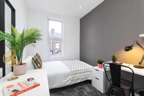 Bright, modern double bedroom with a comfortabl...
