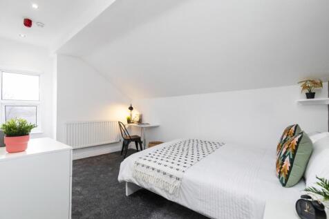 Bright, clean double bedroom with pitched ceili...