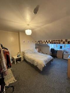 Bright, neatly presented bedroom with a comfort...