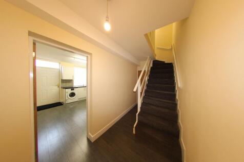 Bright, well-maintained entry hallway with mode...