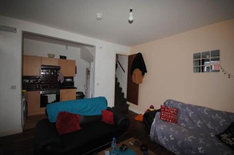 Cosy furnished living room with two sofas, a co...