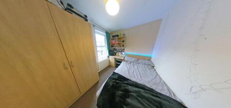 Cozy furnished bedroom with a comfortable singl...