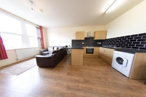 Bright open-plan living area with large windows...