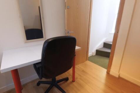 Bright, tidy workspace with a simple white desk...