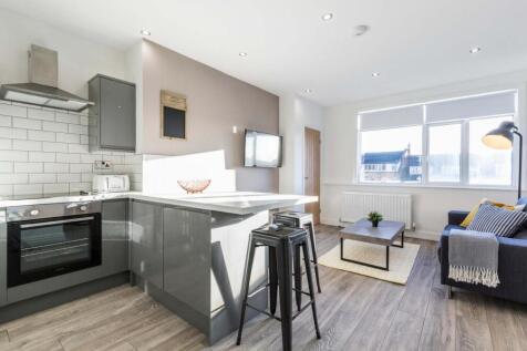 Bright, modern open-plan living space with a co...