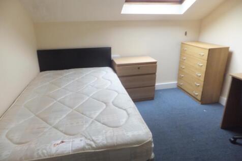 Bright attic bedroom with a fitted skylight, si...