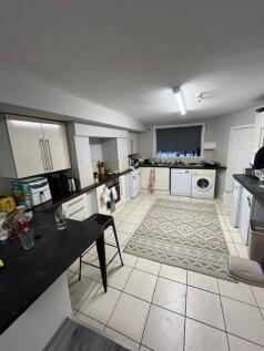 Bright, modern kitchen with plentiful storage, ...