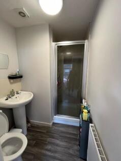 Compact bathroom with a shower cubicle, pedesta...