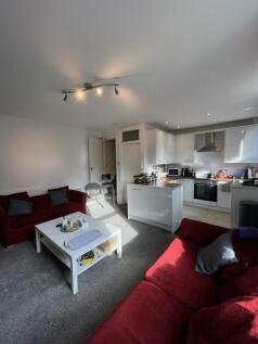 Bright open-plan living area with comfortable r...