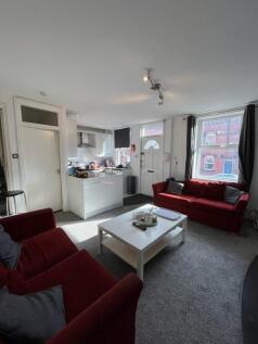 Bright open-plan living area with comfortable r...