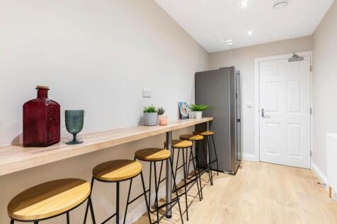 Bright modern kitchenette with a long breakfast...