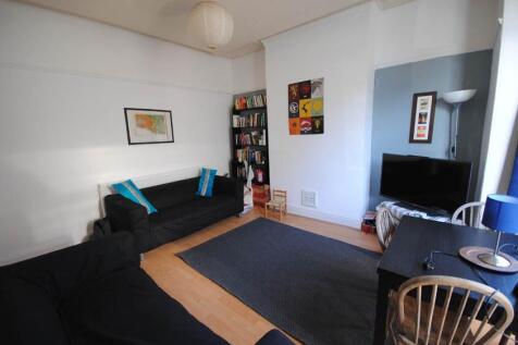 Bright, modern living room with comfortable sof...