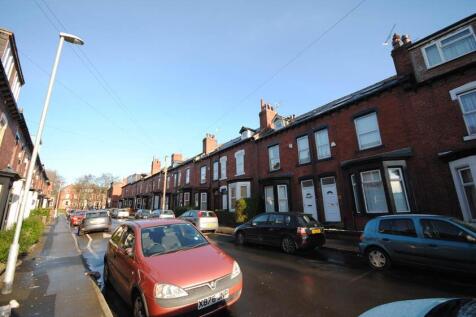 Sunny street of well-maintained red-brick terra...