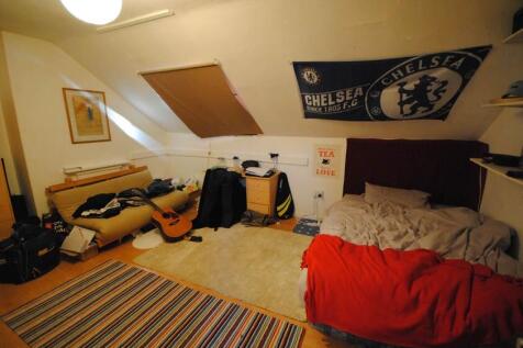 Cozy attic double bedroom with sloped ceilings,...