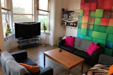 Bright, comfortable living room with bay window...