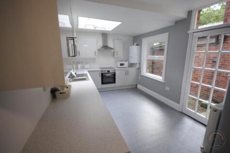 Bright modern kitchen with wide worktops, integ...