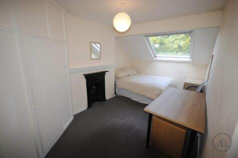 Bright, neatly presented bedroom with a large d...