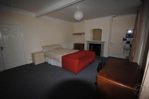 Spacious bedroom with a comfortable double bed,...