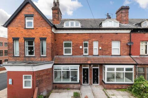 Attractive red-brick terraced property with bay...