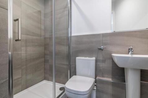 Modern bathroom with a walk-in shower, contempo...