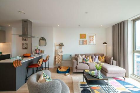 A bright and stylish large modern living room w...
