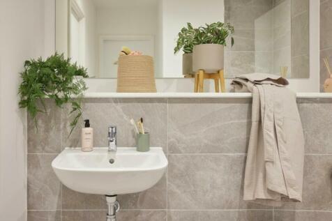 A clean and modern bathroom featuring a stylish...