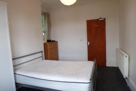 A bright and spacious double bedroom with ample...