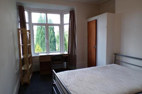 A bright and spacious double bedroom featuring ...