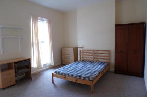 A bright and spacious double bedroom with ample...