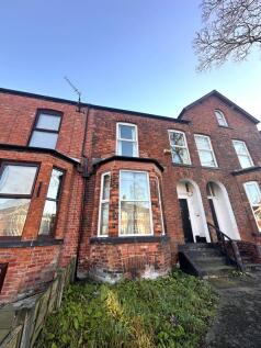 A charming exterior view of the property showca...