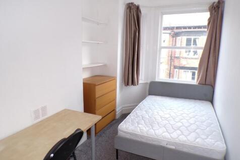 A bright and inviting double bedroom with ample...