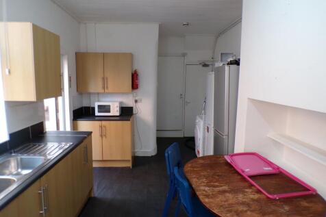 A functional and bright kitchenette with modern...