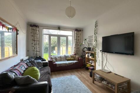 A spacious and bright modern living room with l...