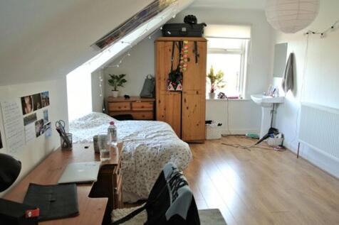 A spacious and well-lit large double bedroom, p...