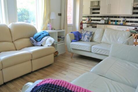 A spacious and inviting modern living room perf...