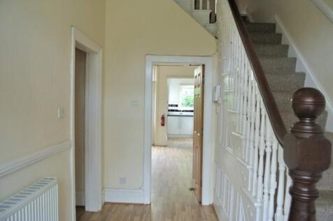 A spacious and tidy hallway leading to various ...