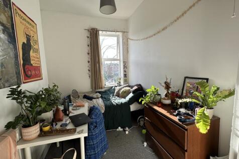 A cozy double bedroom filled with natural light...