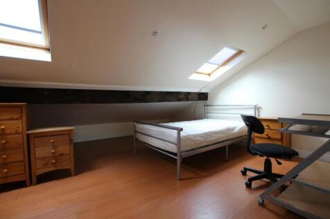 A spacious and inviting double bedroom featurin...