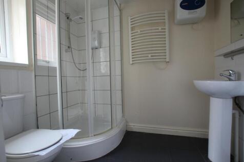 A clean and functional bathroom featuring a mod...